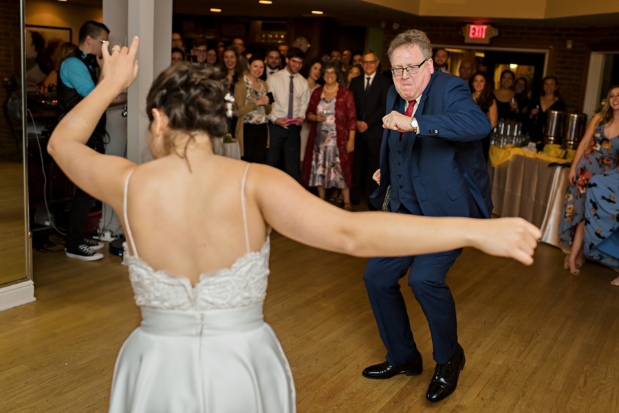 A father dancing with his daughter at the wedding reception in south Philadelphia.